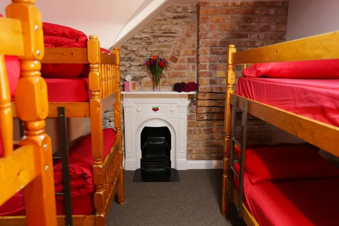 Bunk beds either side of a converted fireplace in one of our dorm rooms